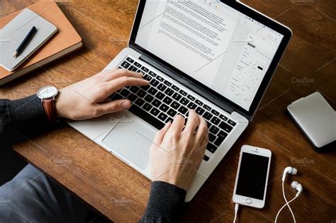 Man At Desk Typing On Laptop By Moyo Studio On Creativemarket Business