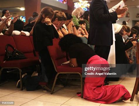 Woman Knees Praying Photos And Premium High Res Pictures Getty Images