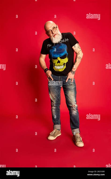 Full Length Portrait Of Bearded Mature Bald Man In Glasses And Casual Stylish Clothes With