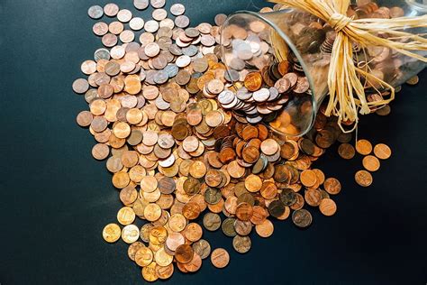 coins glass vase pennies money currency cash finance banking