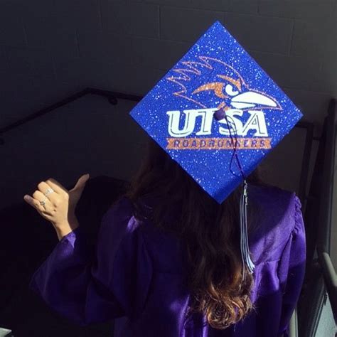 a female student wearing a purple graduation cap and gown