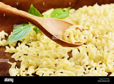 Raw Fusilli Pasta Background Stock Photo Alamy