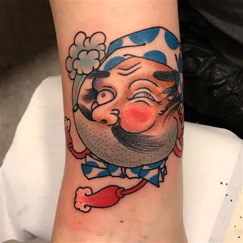 Hyottoko Tattoos Explained: History, Common Themes & More