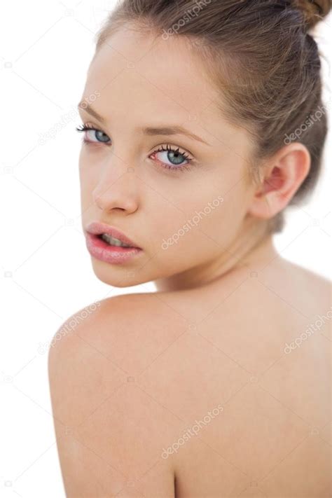 Thinking Brunette Model Posing Looking Over Her Shoulder Stock Photo