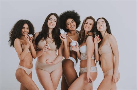 Premium Photo Smiling Multi Ethnic Women In Lingerie Holding Beauty