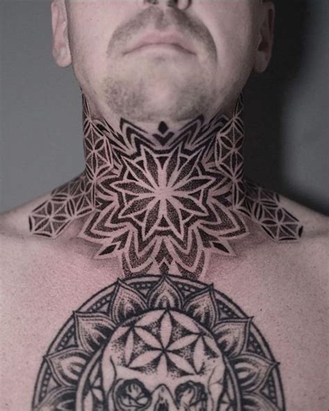 A Man S Neck Is Adorned With Intricate Designs And A Skull In The Center