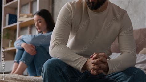 Annoyed Caucasian Husband Sit Apart On Bed With Offended Wife Keep