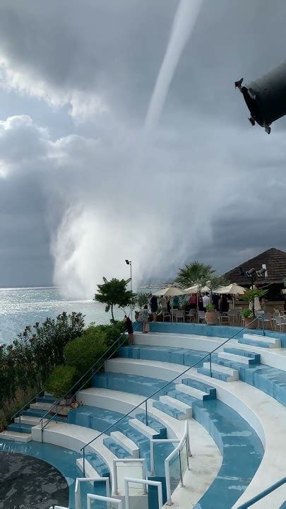 Waterspout Moving Close To Restaurants By The Shore Youtube