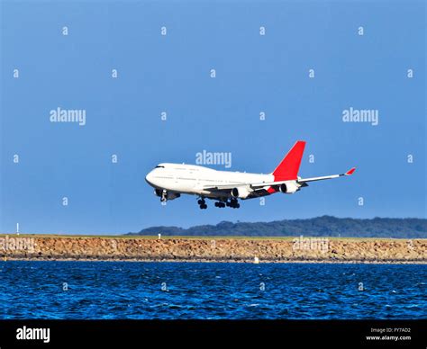 oversized double-deck airplane approaching airport runway during ...