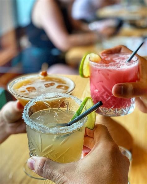 Premium Photo Close Up Of Hands Holding Cocktail Drinks