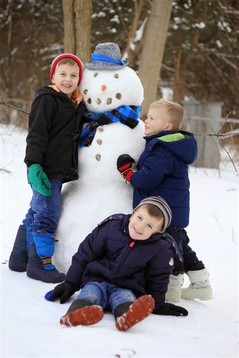 kids posing with snowman 2 - Raising Roberts