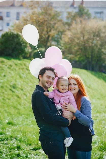 Premium Photo A Young Redheaded Mother Plays In The Park With Her