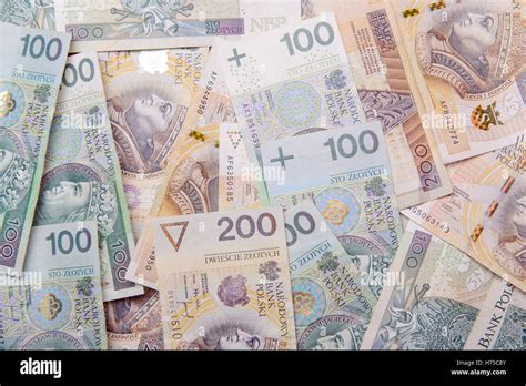 Polish Zloty In Notes And Coins On Red Background Stock Photo Alamy