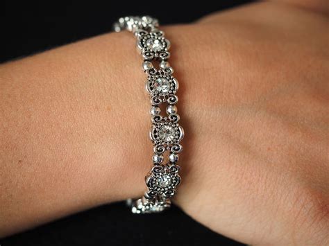 Person Wearing Silver Colored Bracelet Bracelet Bangle Jewellery