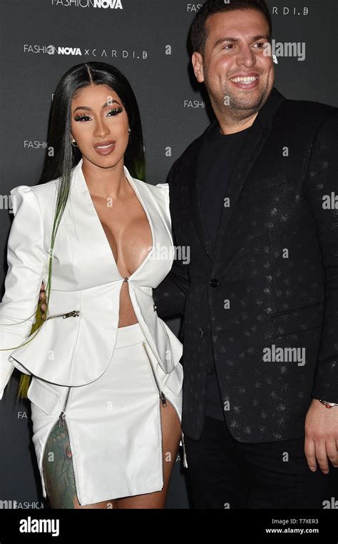 LOS ANGELES, CA - MAY 08: Cardi B (L) and CEO of FashionNova Richard Saghian attend the Fashion ...