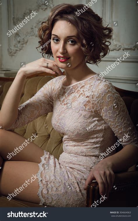 Curly Brunette Pink Dress Sit Sofa Stock Photo 304664063 Shutterstock