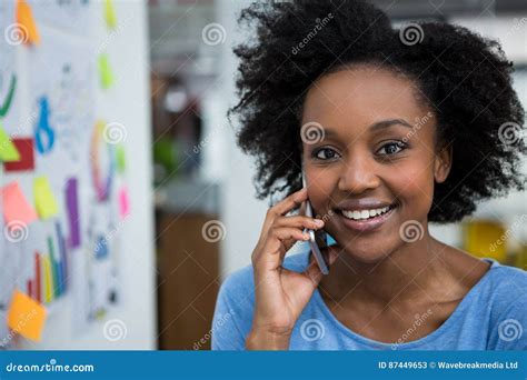 Smiling Graphic Designer Talking On Mobile Phone Stock Image Image Of