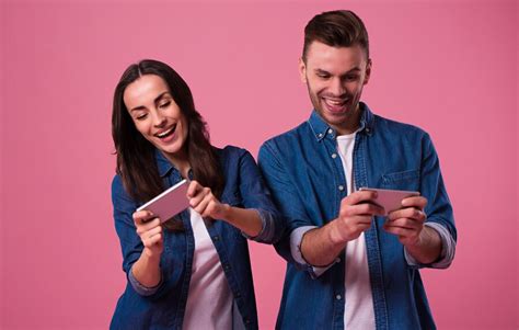 Premium Photo Young Excited Couple Standing Isolated Over Pink