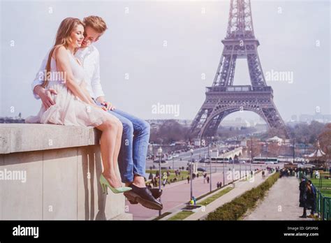 Romantic Love Affectionate Couple Sitting Near Eiffel Tower In Paris Honeymoon In Europe Stock