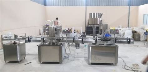 Automatic Four Head Volumetric Liquid Filling Machine At Best Price In