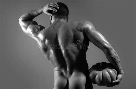 Halloween Man With Pumpkin And Buttocks Fashion Brutal Guy With Naked Torso Stock Photo