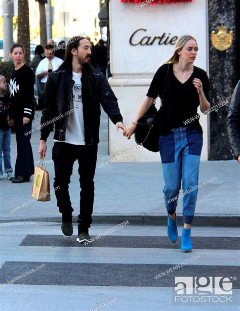 Musician Steve Aoki Hold Hands With His Fiancee Tiernan Cowling As They