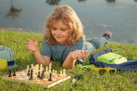 Chess Game for Kids. Child Playing Chess Outdoor in Park. Stock Image ...