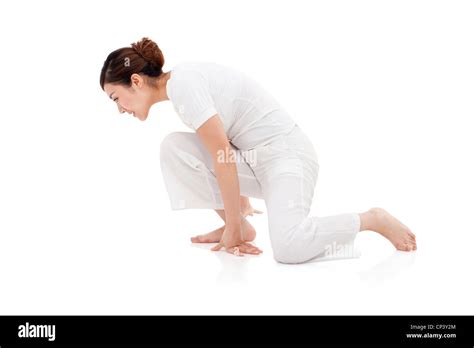 young woman crouched   floor stock photo alamy