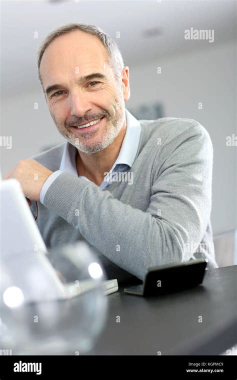 Mature Man Working From Home With Laptop Computer Stock Photo Alamy