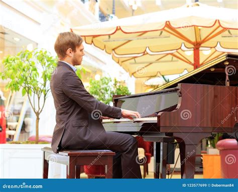 Handsome Young Men Playing Piano At The Restaurante Stock Image Image