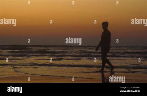 Man In Silhouette Gives A Thumbs Up At Sunset In A Beach In Cox S Bazar