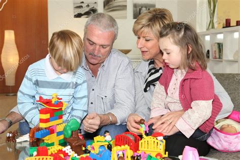 Grandparents And Grandchildren Playing — Stock Photo © Photography33