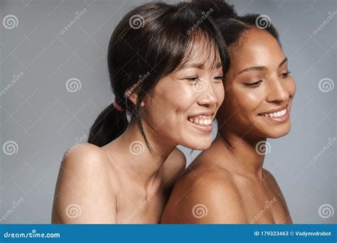 Portrait Of Two Multinational Half Naked Women Hugging And Laughing Stock Image Image Of Asian