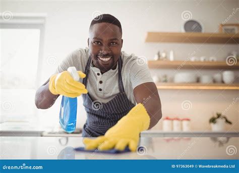 Smiling Man Cleaning The Kitchen Worktop Stock Image Image Of Adult