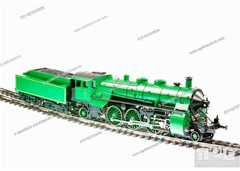 Isolated toy train with a steam engine locomotive, Stock Photo, Picture ...