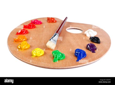 Photo Of A Wooden Artists Palette Loaded With Various Colour Paints And