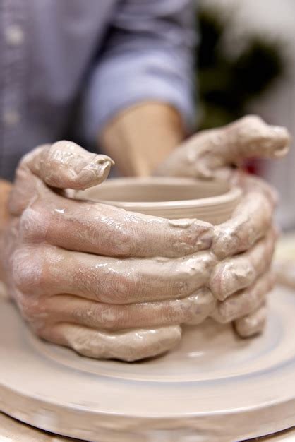 Premium Photo Male Hands Making Ceramic Cup On Pottery Wheel Closeup