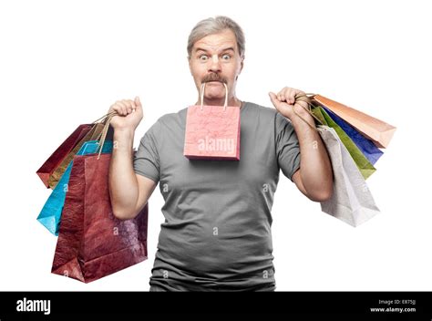 Surprised Mature Man Holding Shopping Bags Isolated On White Background