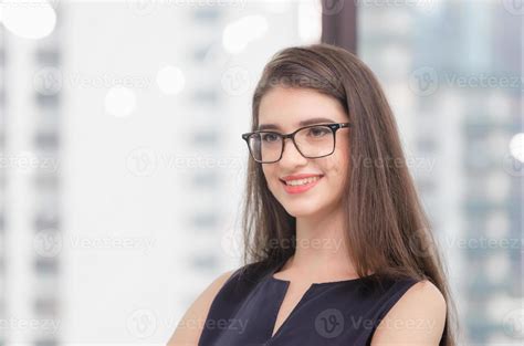 Headshot Of Successful Smiling Cheerful Business Woman In Office