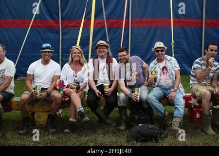 Festival Goers Enjoying A Drink In A Hammock In The Coca Cola Share A