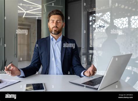 Mature Successful Senior Experienced Man Meditating In Lotus Position