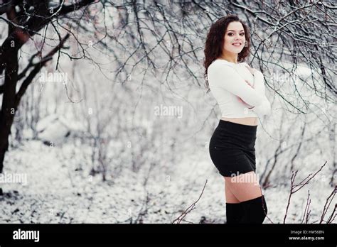 Curly Brunette Girl Background Falling Snow Wear On Black Mini Skirt And Wool Stockings Model