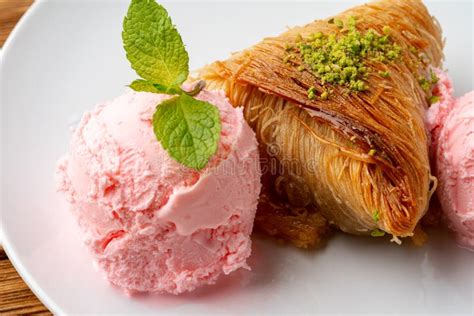 Close Up Photo Of Turkish Baklava Served With Ice Cream Stock Photo