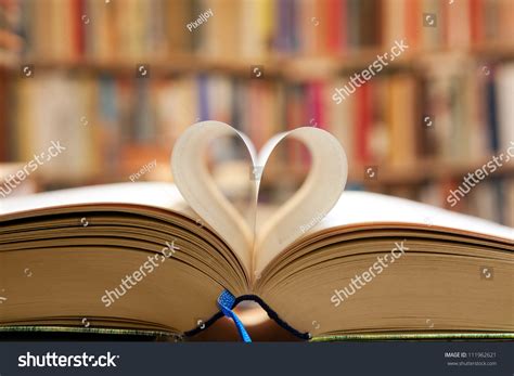 Book Page In Heart Shape With Library Background Royalty Free Stock