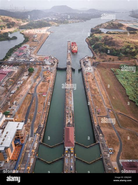 Aerial View Cargo Ship At The Lock In The Panama Canal From Above