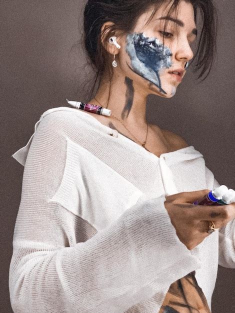 Premium Photo Close Up Of Woman With Face Paint Against Wall