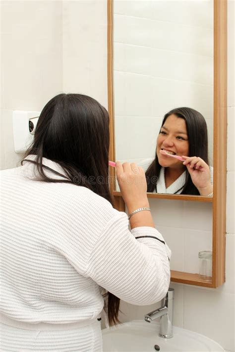 Latina Year Old Woman Brushes Her Teeth To Prevent Cavities Dressed In Bathrobe In The