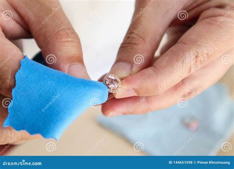 Jeweller Hand Polishing and Cleaning Jewelry Diamond Ring Stock Photo ...