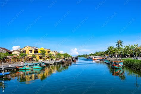 Hoi An Ancient Town In The Sunshine Day With Blue Sky Fishing Boats