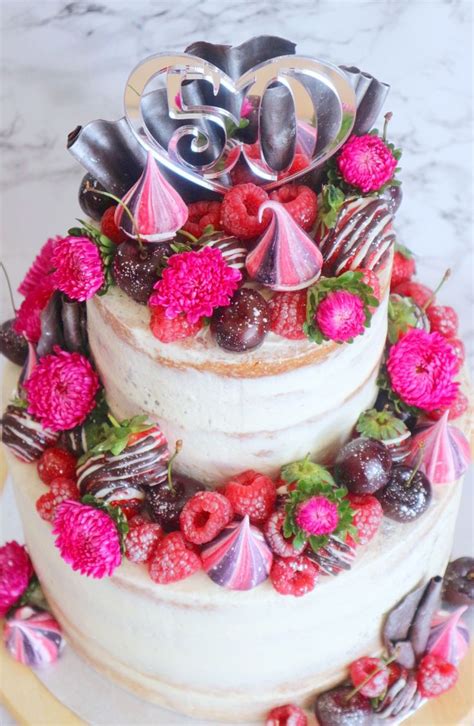 Semi Naked Cake Topped With Chocolate Dipped Strawberries Meringue